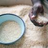 Close up of hands holding rice in an African market