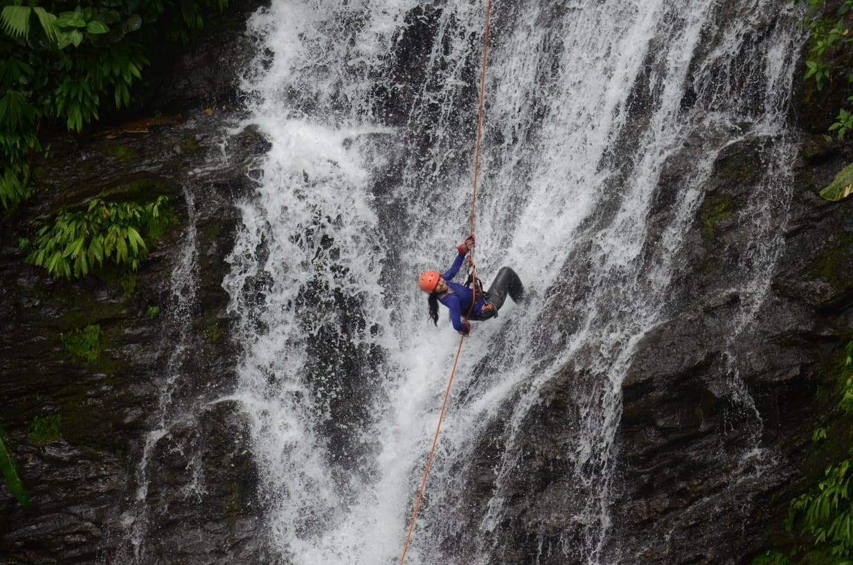 Cindy abseiling a waterfall