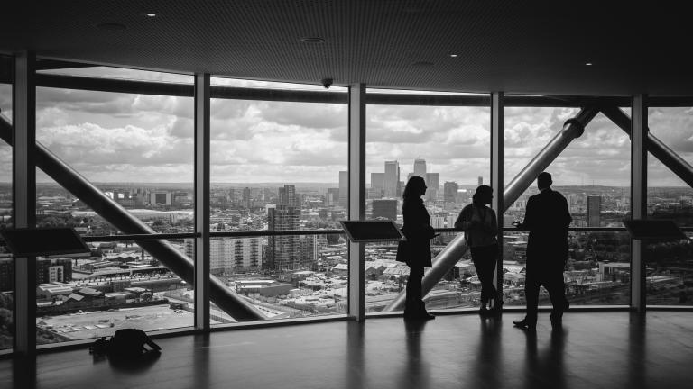 Discussions infront of an window facing a city