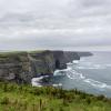Ireland countryside tourist attraction in County Clare. The Cliffs of Moher and castle Ireland. Epic Irish Landscape UNESCO Global