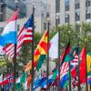 Rows of flags of all nations next to UN in New York City