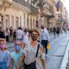 Family wears protective mask while walking in the city