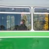 People traveling with the tram wearing face masks for protection during coronavirus COVID-19 and flu pandemic in Graz, Styria region, Austria.