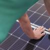 Installation, Connection and mounting of solar panels. Workers fasten solar panels. Technicians installing solar panels