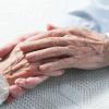 Old people holding hands