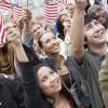 People Holding Up American Flags
