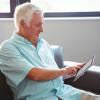 Senior man using a digital tablet