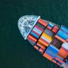 Freight ship on open sea photographed from above
