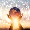 Abstract image: hand holding Earth against sunset with network concept superimposed