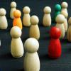 Beige and colored pawns grouped together
