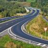Highway cutting through the countryside