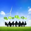 Silhouetted people working outside with sustainability concept background