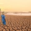 Child looking at dried up river