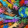 earth day and international world culture as acrowd cooperation depicted as diverse hands holding together the planet earth 