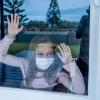 girl in lockdown looking out of the window