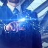 Businessman pointing at abstract blue business chart