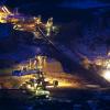 Coal mine lit up at night
