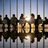 Business meeting with people in silouette against a window