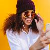 Young African woman with cellphone