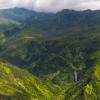 Green mountains and valley with waterfall