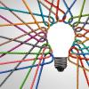 Network of ropes tied together to create an image of a lightbulb. 