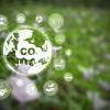 Reduce CO2 emission concept with green background and icons depicting ways to help reduce carbon dioxide in the air. 