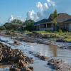 Devastating aftermath of inadequate flood management: Muddy floodwaters after heavy rainfall