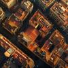 Aerial View of Urban Landscape at Sunset. Warm Light Bathing City Rooftops.