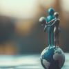 Ethics concept. Two human figures standing on top of an Earth globe