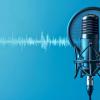 A high quality studio microphone with soundwaves in the background