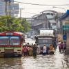 Flood disaster in Thailand with people being evacuated from their houses boarding a bus