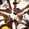 Young adults using smartphones in a circle