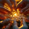 Hands working together on a jigsaw puzzle