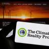 Smartphone with logo of organization The Climate Reality Project on screen in front of website. Focus on phone display.