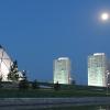 Evening in Astana Kazakhstan. Full moon rising over Astana Kazakhstan landmark and residential buildings 