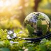 Healthcare innovation symbolized by stethoscope and glass globe among lush forest celebrating World Environment Day.