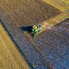 Aerial Photo Of Milling Truck On Field Harvesting Crops