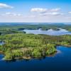Aerial panorama of the Saimaa lake areas and boreal forests in Finland.