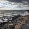 A parking lot is being swallowed by the sea - evidence of rising sea levels due to climate change. 