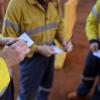 Construction miner workers conducting self risk assessment call as take five step prior to work of each task