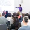 Audience in lecture hall participating at conference