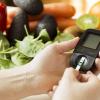 Diabetes monitor, diet and healthy food eating nutritional concept with clean fruits and vegetables with diabetic measuring tool kit 