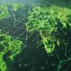 A network of corporate sustainability efforts depicted as green nodes interconnected on a global map