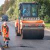 Road workers and equipment in the summer heat