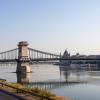 Low water level of the Danube river in Budapest at sunrise, island bridge