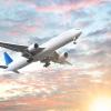 airplane flying in the sunset